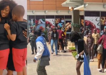 “She knows her job” – Viral video of nanny covering faces of Funke Akindele’s twins in public stirs reactions (Watch)