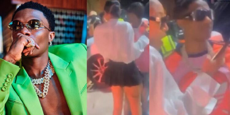 “Where’s Jada?” – Fans reacts to video of Wizkid hanging out with mystery lady at a club (Watch)