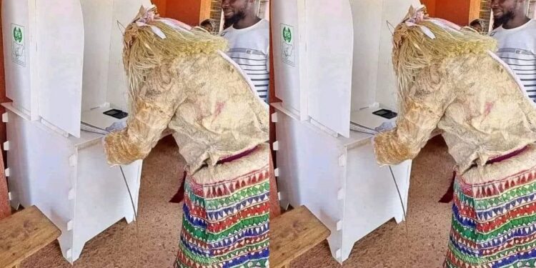 “Even the gods want better life” – Reactions as a masquerade  is spotted casting vote in Lagos