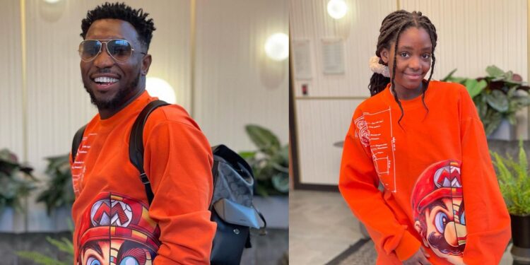 “She even rocked it better” – Reactions as singer Timi Dakolo shares adorable photo of his daughter rocking his cloth
