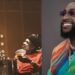 Wizkid’s baby mama under fire for promoting “More Love Less Ego” on Davido’s album release day