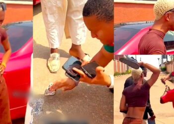 Crossdresser, James Brown creates a scene in Asaba after man damaged his phone (Video)