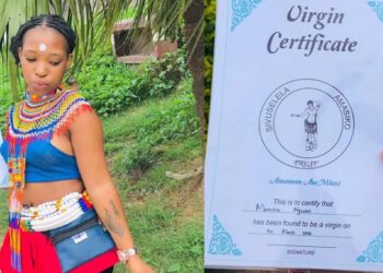 Mixed reactions as pretty lady proudly flaunts her certificate of virginity