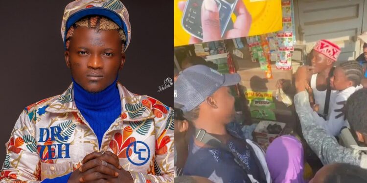 Portable shows his benevolent side as he buys and share groceries to residents and gifts N100K to a student