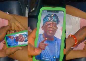 Man angrily takes back iPhone from his babe after seeing Tinubu as her wallpaper (Video)