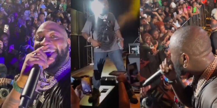Lady excited as Davido collects her phone during concert and records himself with it (Video)