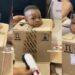 Father puts troublesome son inside box to barb his hair