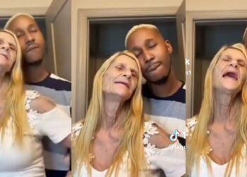 “All in the name of Canadian passport” – Reactions as young man shares loved-up moment with elderly foreign lover (Video)