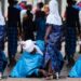 Trending photo of a father helping his daughter with her shoes during Eid celebration in Ilorin