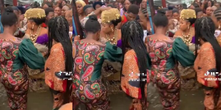 “Are halls that expensive?” – Reactions as bride defies flood to dance with her girls at her wedding (Video)