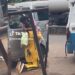 Nigerian man goes down on his knees in motor park to propose to his girlfriend (Video)