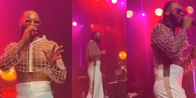 Singer, Flavour, causes a stir as he performs on stage in crop top and stylish pants (video)
