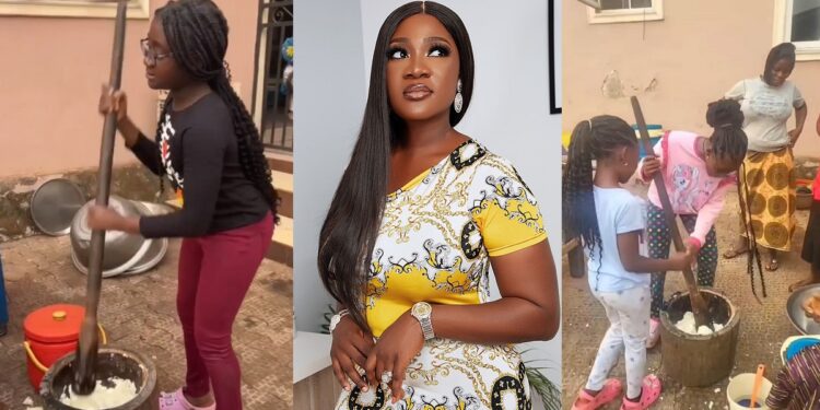 “If you can eat it, you can pound it” – Mercy Johnson teaches her daughters how to pound yam (Video)