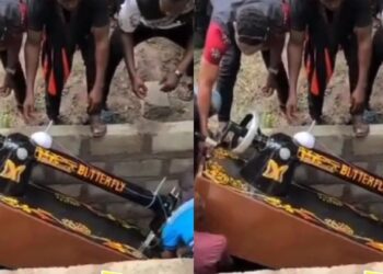 “Sew till thy kingdom come” – Reactions as tailor is buried inside sewing machine shaped coffin (Video)
