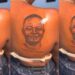 “When them break up she go cut that place comot” – Reactions as lady tattoos her boyfriend’s face on her back