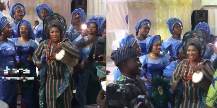 “As a guest I would empty my pocket” – Reactions as beautiful bride wows at her wedding ceremony with talking drums (VIDEO)