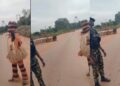 “The gods dey fear Gun” – Reactions as masquerade refuses to beat military personnel (VIDEO)