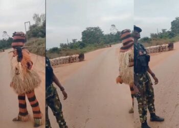 “The gods dey fear Gun” – Reactions as masquerade refuses to beat military personnel (VIDEO)