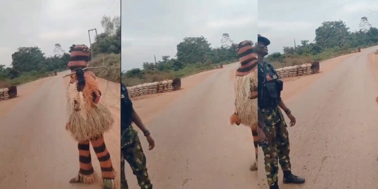 “The gods dey fear Gun” – Reactions as masquerade refuses to beat military personnel (VIDEO)