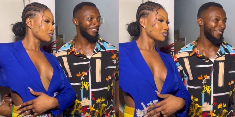 “Na because the guy no get money” – Reactions as Tacha stylishly removes man’s hand after he held her waist during photo-op