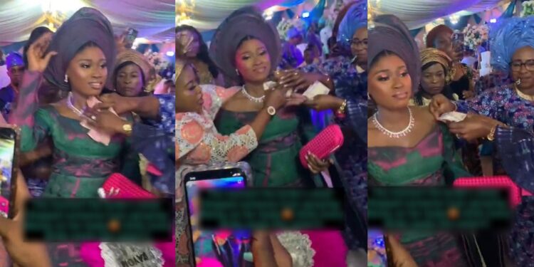 “I need this kind of sister” – Reactions as bride’s sister stops wedding guest from placing money on her body (VIDEO)