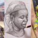 Nigerian artist warms hearts after gifting an orange seller a piece of his artwork