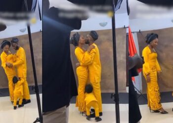 “I talk am! Nah man dey do man” – Kid pushes dad away from his mum during a photoshoot session (VIDEO)