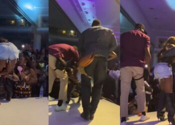 Netizens rage as a fan refuses to let go of Tiwa Savage on stage