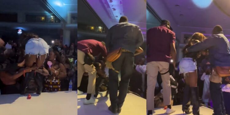 Netizens rage as a fan refuses to let go of Tiwa Savage on stage