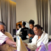 “That lady wey wear black no get emotion at all…” – Reactions as apprentice looks confused as a bride receives a package from her best friend (VIDEO)