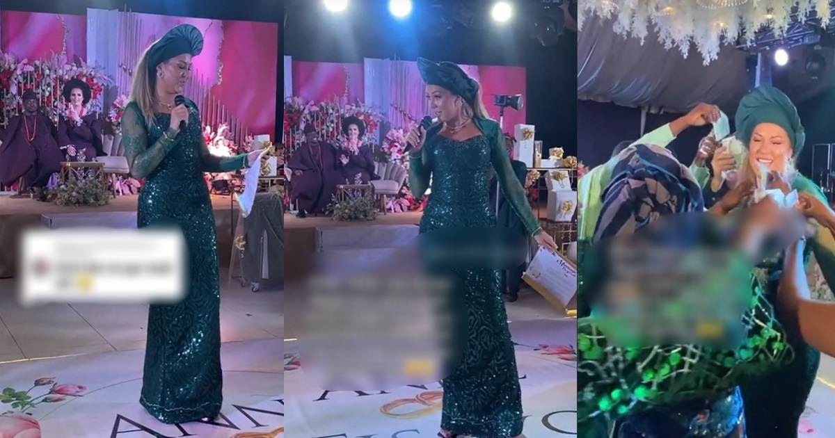 “Sisterhood is proud of you” – Adorable moment German lady demands guests to spray her before reading the letter at a Nigerian wedding (VIDEO)
