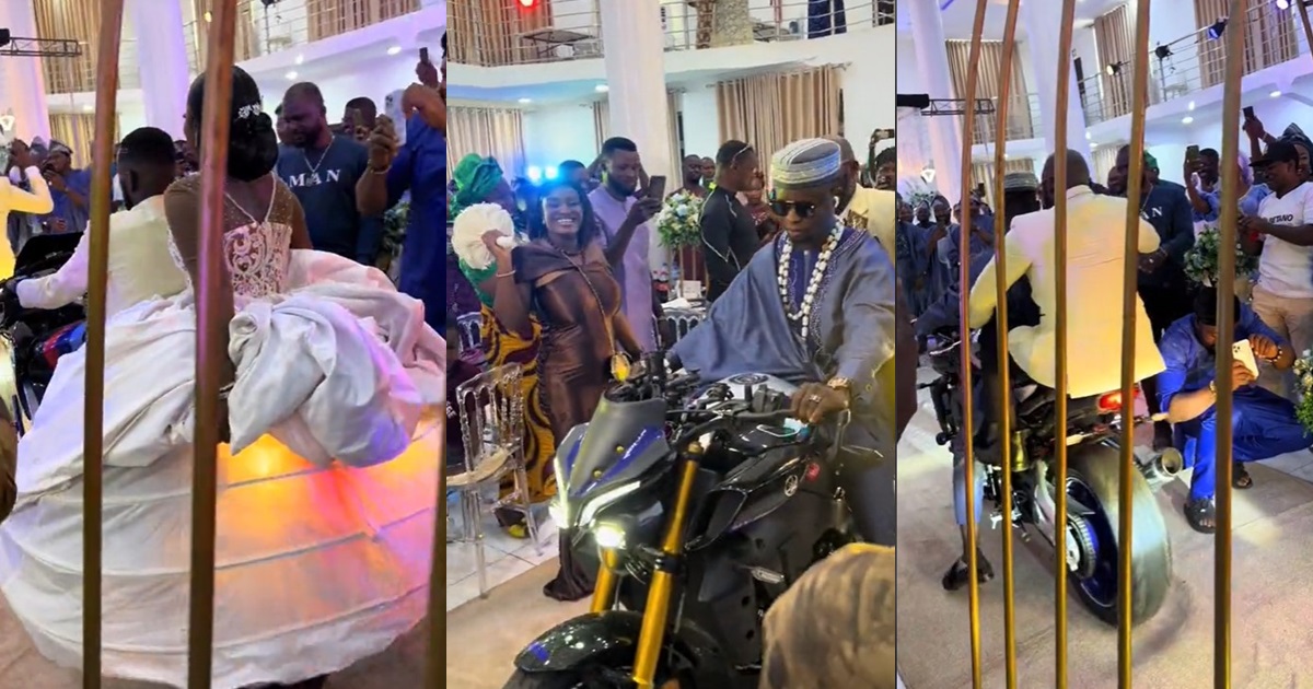 “Bride go soon ride bike”- Netizens react as couple arrive to their wedding reception on a bike (WATCH)