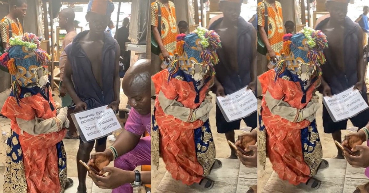 “Araorun dey collect transfer” – Viral Video of Masquerade collecting money transfer (WATCH)