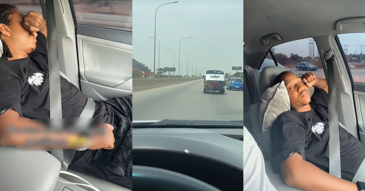 “His trust is in the seat belt” – Lady jubilates as her boyfriend sleeps off while she is driving on the highway (VIDEO)