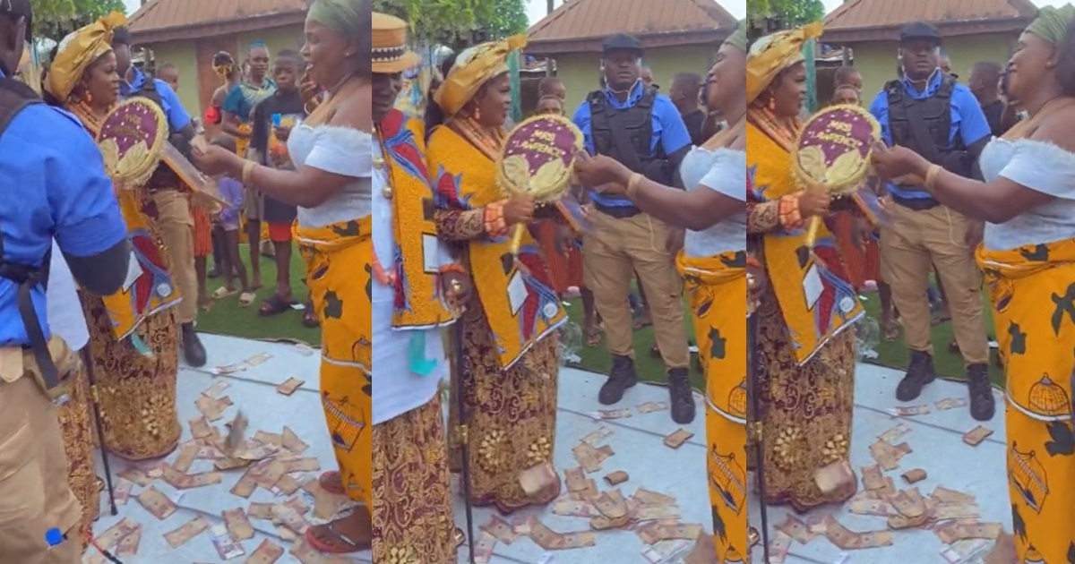 Lady is astonished as her boyfriend’s mother sprays bundles of naira notes at her sister’s wedding (VIDEO)