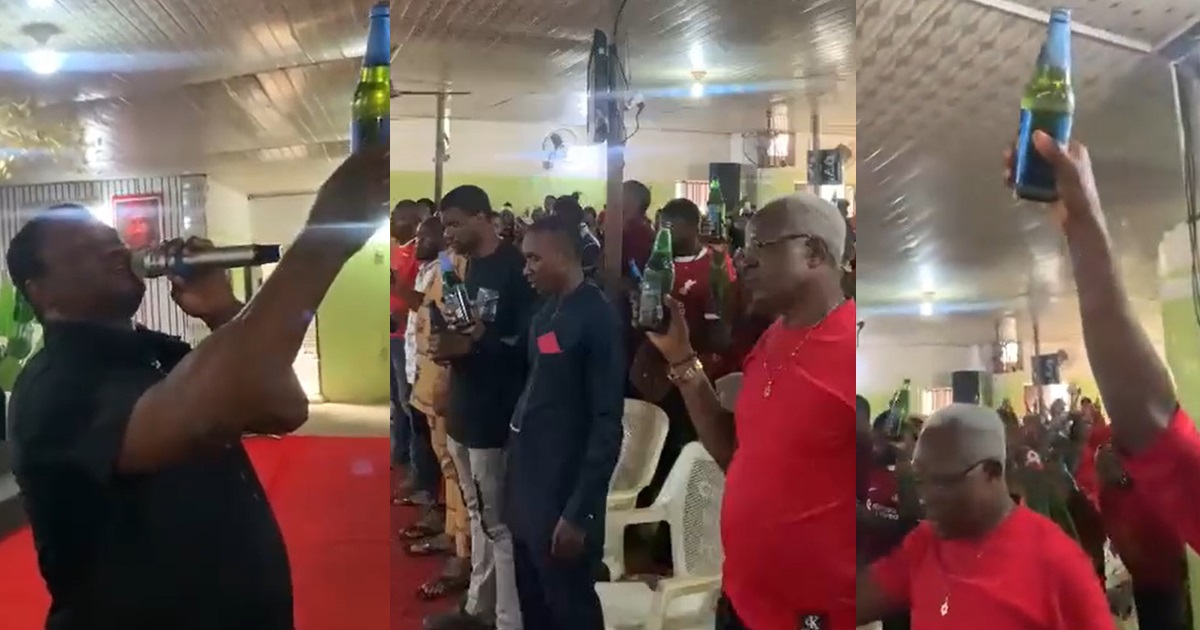 “They are lifting their trophies to God” – Moment a pastor and his congregation were seen holding a bottle of beer while praying in church (VIDEO)