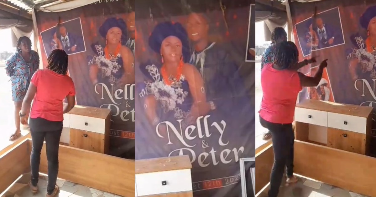 “Give me the banner or I take away one of her furniture” – Woman r@ges after seeing her wedding banner on display at a roadside furniture shop (WATCH)