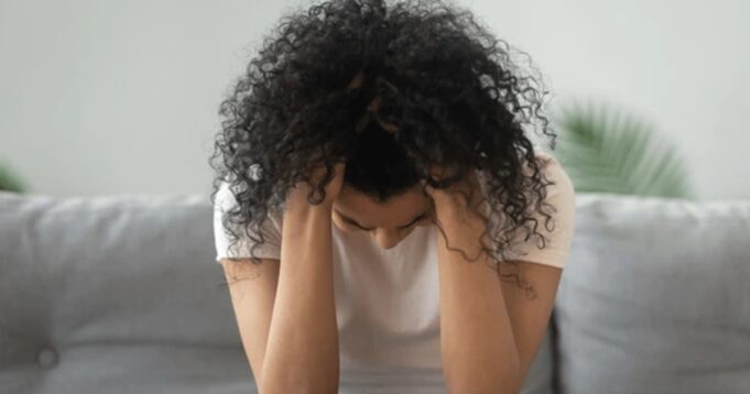 stressed-miserable-black-woman-hold-600nw-1444224854