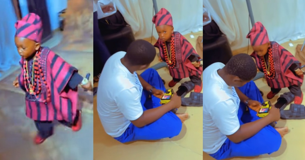 Hilarious moment toddler inspects his poses on a photographer’s camera during a photo shoot (WATCH)