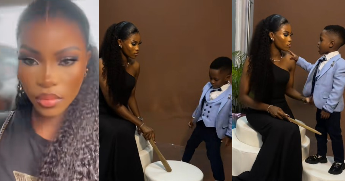 Nigerian mum uses a wooden stick to caution her son during their photo shoot (WATCH)