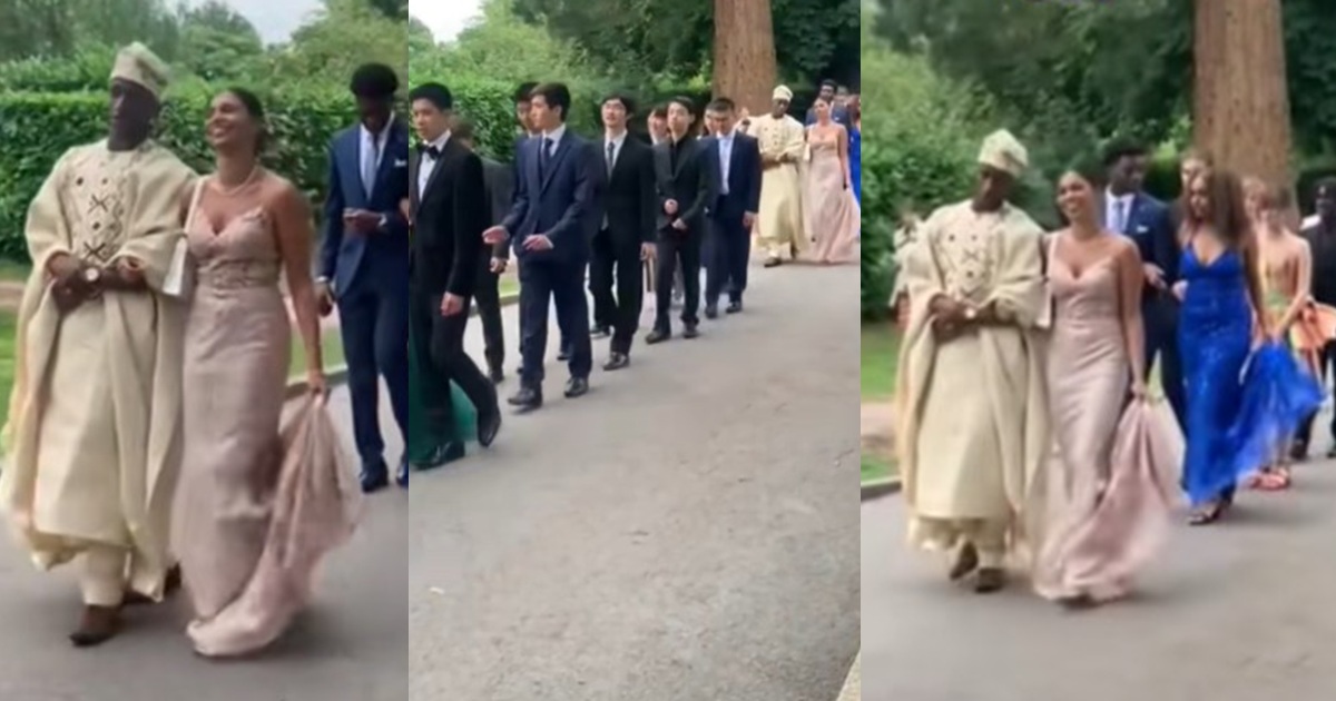 “Everyone looks like they attended his wedding” – Man appears unique, dresses like a ‘Yoruba prince’ at his school prom in the United Kingdom (WATCH)