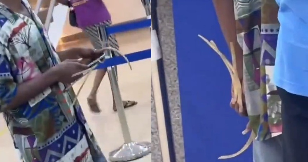 Lady shocked by man’s extremely long nails at the bank (VIDEO)