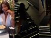 Lady loses balance on the staircase while making a video (WATCH)