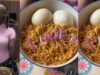 Lady amused after her younger sister uses onions to spell “I Love U” on her noodles meal (Watch)