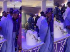 Groomsman caught snacking on wedding cake decorations during ceremony (Watch)