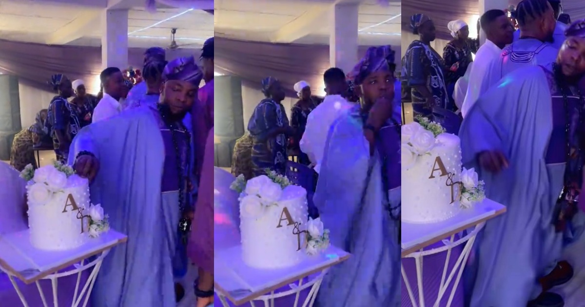 Groomsman caught snacking on wedding cake decorations during ceremony (Watch)