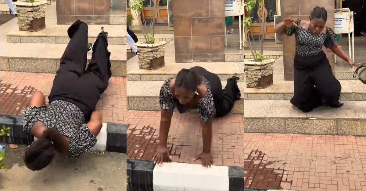 Lady trips while filming at church entrance, quietly walks off in embarrassment (Video)