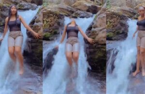 “I first nearly craze” – Lady loses wig while enjoying herself under a waterfall at a resort (Watch)