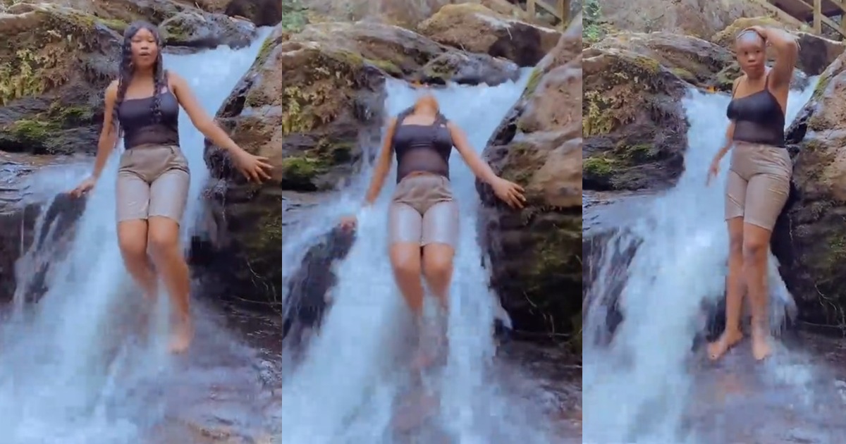 “I first nearly craze” – Lady loses wig while enjoying herself under a waterfall at a resort (Watch)