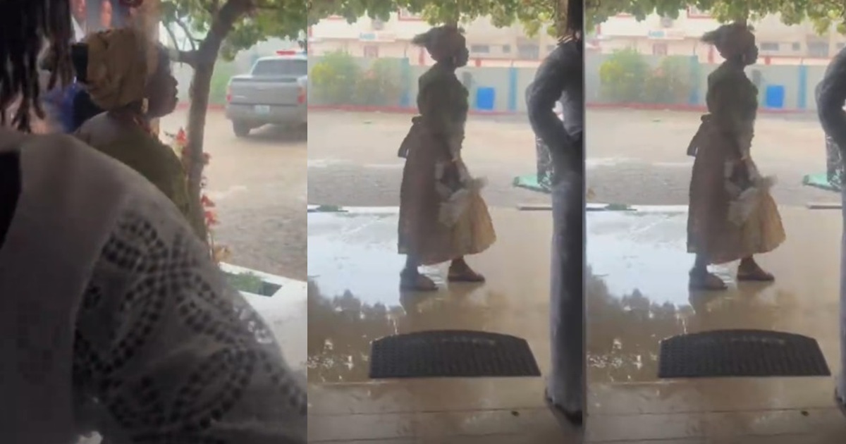 Nigerian mum prays fervently after heavy downpour began on her son’s wedding day.